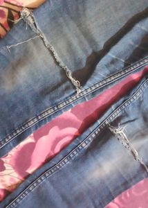 Fadded Damaged Blue Jeans