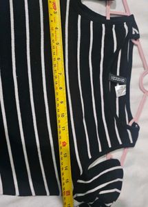 H&amp;M  Black and white striped cold-shoulder top.