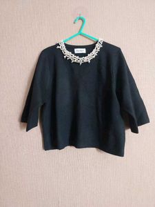 Elegant Black Top with Pearl Detail