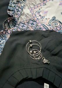 Patterned Dress with Unique Brooch