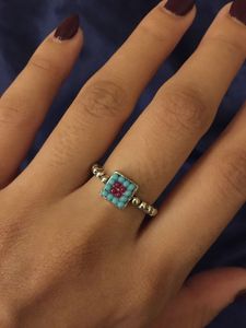 oxidised ring with terquoise and red beads.