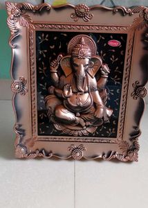 Divine Ganesha Idol in Ornate Frame