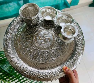 Karva chauth Pooja thali German and silver antique thali mor info inbox me**item code: Swastik pooja thali set**Thali size:Diameter 11”2 katoris1 kalash loti1 deepam