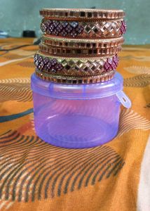 Set of Gold Bangles with Red Accents