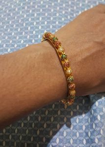 Elegant Gold Bangle with Colorful Bead Accents