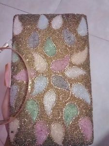 get this  embroidered branded cluch @499