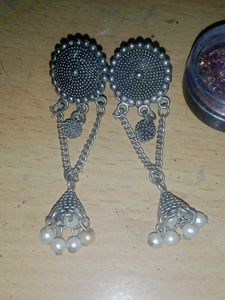 Elegant Jhumka Earrings and nail glitter