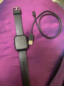 Sleek Black Smartwatch With Charger