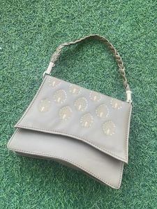 Elegant Clutch with Peacock Detail