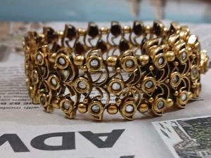 Stunning Gold-Toned Bangle Bracelet with Faux Diam