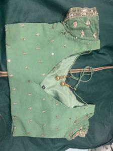 Pastel Green Embroidered Lehenga with Matching Blo