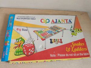 Kids/adults study table and ludo playing.