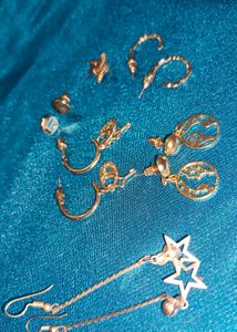 Assorted Gold Tone Earrings and Silver Rings