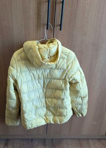 Uniqlo ultra light down jacket in butter yellow