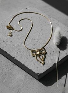 Gold Bow Pendant Necklace