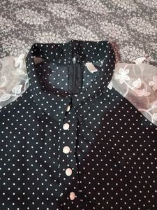 A Black Polyster Top With White Dots Nd Classic .