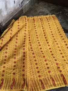 Elegant Yellow Saree with red Blouse.