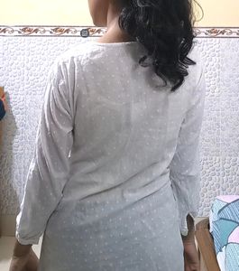 Pure Cotton, White Kurti From The Brand DJ&amp; C.It Has Black Thread Work With Silver Sequins Work.