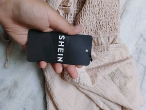 Beige Romper with Ruffle Detail