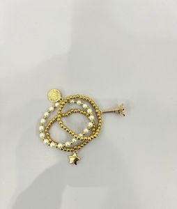 3 Beaded Pearl Bracelets With Charms