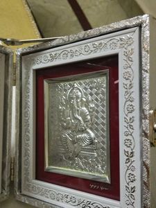 Silver lakshmi ganesh in dairy frame