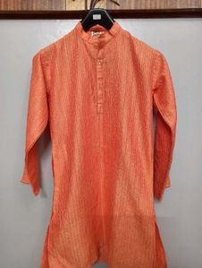 Orange Kurta With Silk Work On It.