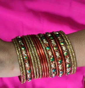 Orange And Golden Colour Bangles