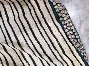 Green,red,black and white standard saree.