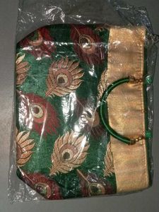 Elegant Maroon Clutch with Peacock Design