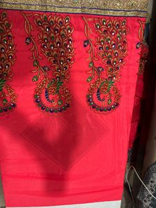 Elegant Pink Sari with Peacock Design