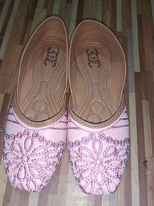 pair of traditional pink embroidered juttis