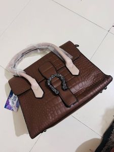 brown medium handbag 👜