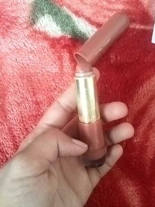 Hilary Rhoda Lipstick and a art piece