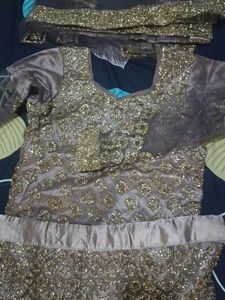 lehenga with small pipes like beads.