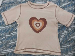 beige crop top with brown heart