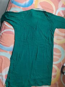Dark green cotton kurta ...three quarters sleeves...beautiful neck line...no flaws..