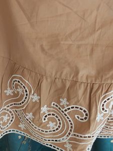 Tan Skirt with Embroidered Hem