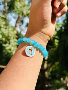 Light Blue Glass Beads Bracelet With Hanging Charm.