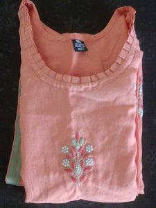 Its a orange Colour Kurta With Hand Work Design