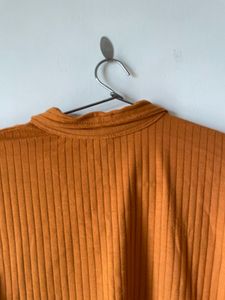mustard brown top