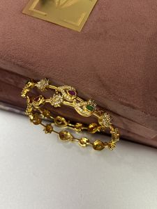 2.6 Gold Polish Set Of Two Bangles American Diamon
