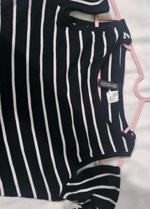 H&amp;M  Black and white striped cold-shoulder top.