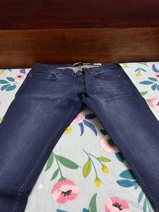 Bare denim Dark blue jeans
