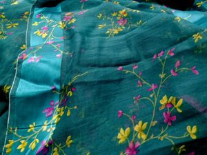 Graceful Teal Green Saree with Floral Design