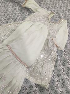 A Light green Sharara suit