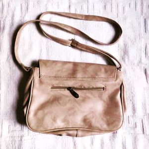 Cream Sling bag.