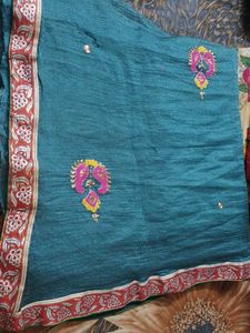 Embroidered super net saree with red border