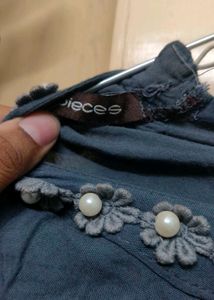 A Dark Grey Top With Beads