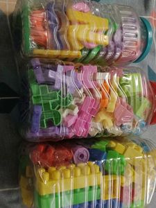 Kids Playing Combo Of 4 Blocks And Alphabet
