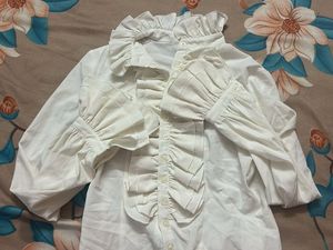 white ruffle shirt